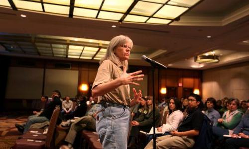 Scientist speaking at town hall meeting